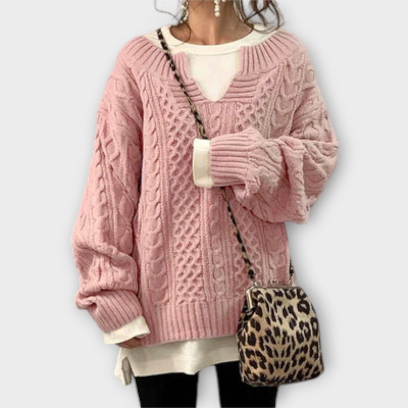 Oversized knitted sweater with cable pattern