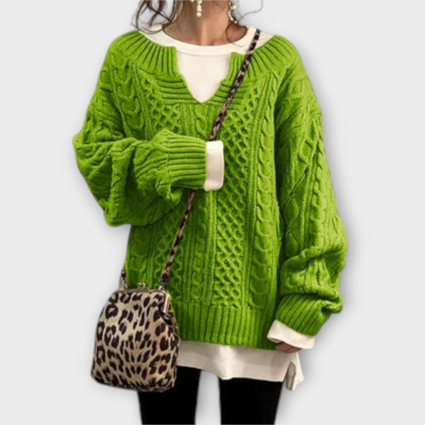 Oversized knitted sweater with cable pattern